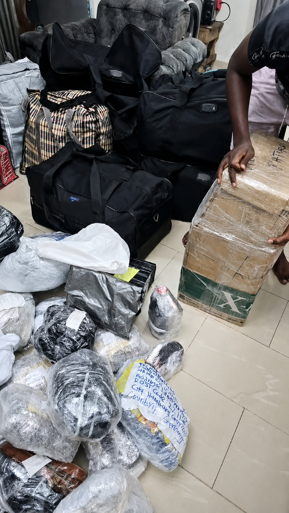 MO Logistics staff carefully packing parcels at Lagos warehouse