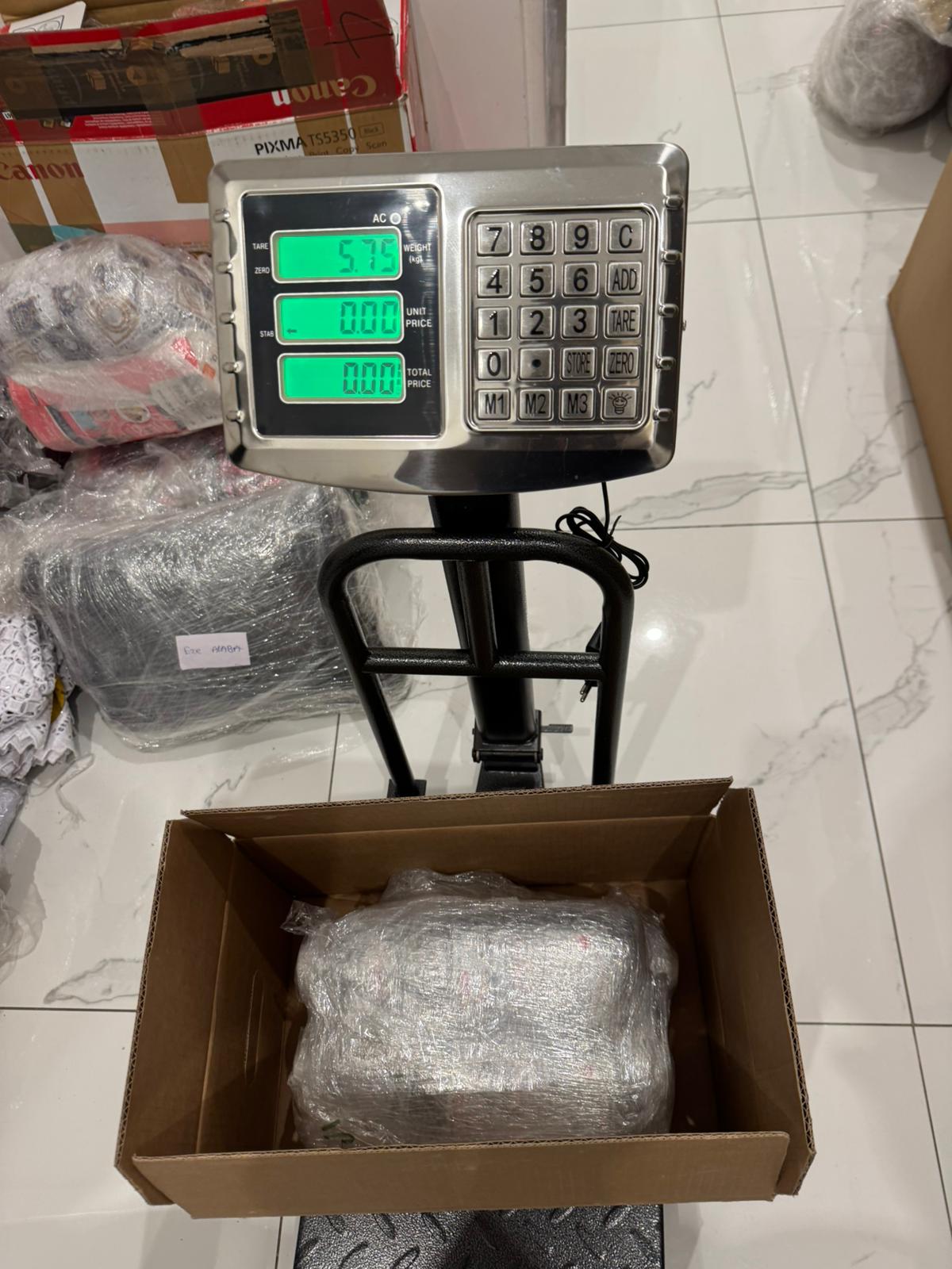 Packages being weighed before Nigeria to Germany shipment